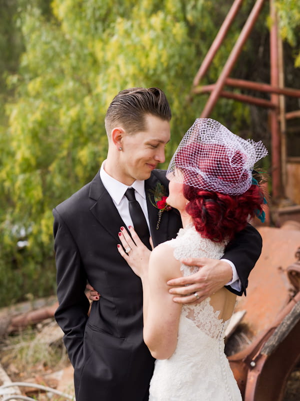 Groom with arm around bride