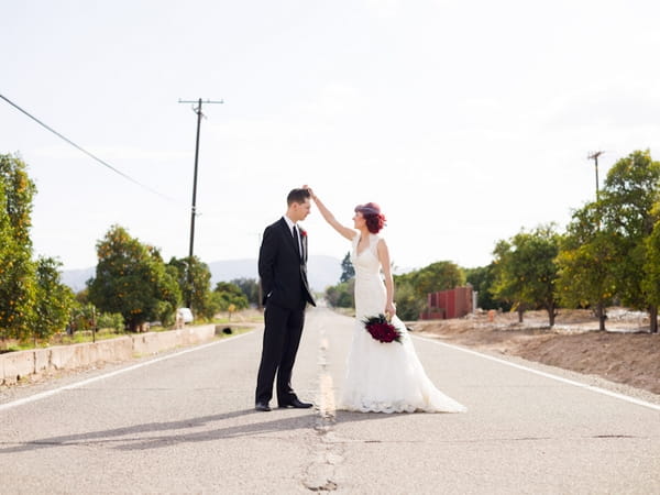 Bride adjusting groom's hair