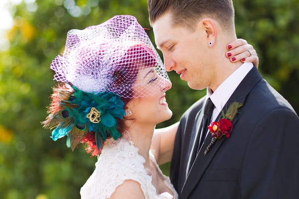 Bride and groom smiling at each other