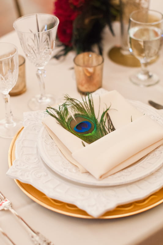 Napkin on wedding table with peacock feather