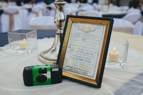 Camera on wedding table with sign