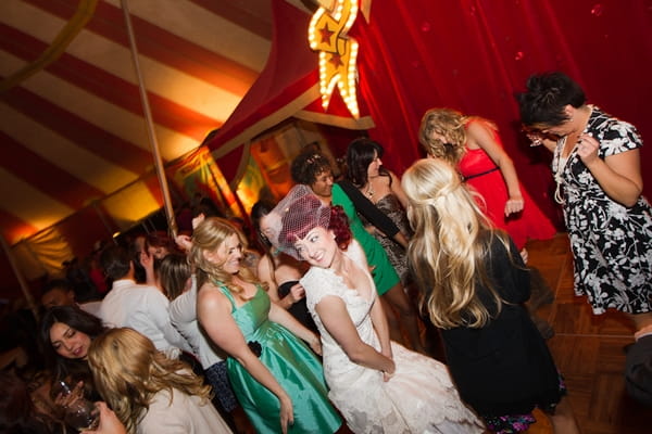 Bride and wedding guests dancing