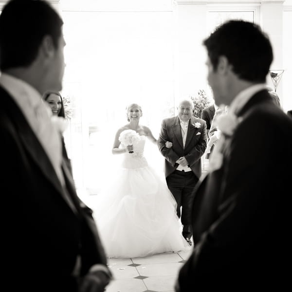 Groom watching bride walk down the aisle - Picture by Aaron Collett Photography