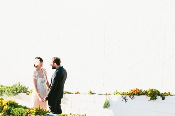 Bride and groom looking at each other