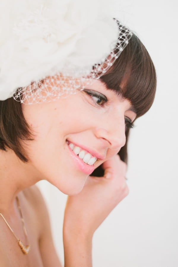 Bride putting on earring