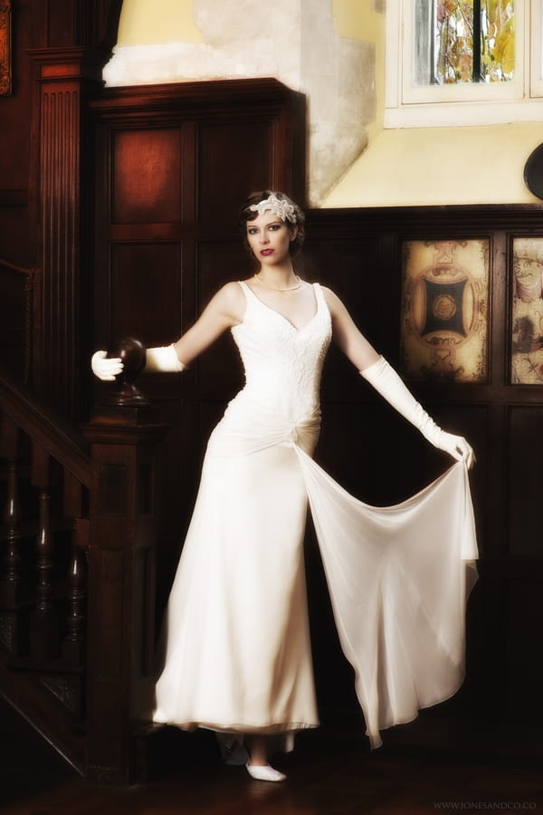 1920's bride at bottom of stairs