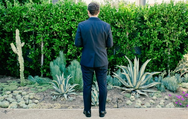 Groom with back to camera