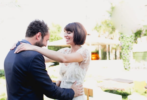 Bride and groom admire each other's look