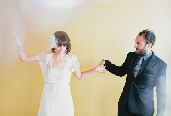 Bride and groom holding hands