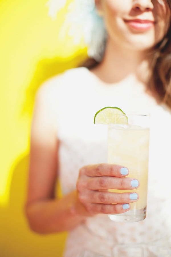 Bridesmaid holding cocktail