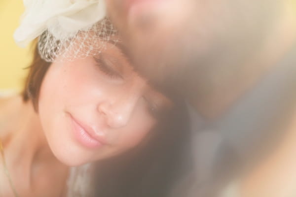 Bride with head on groom's shoulder