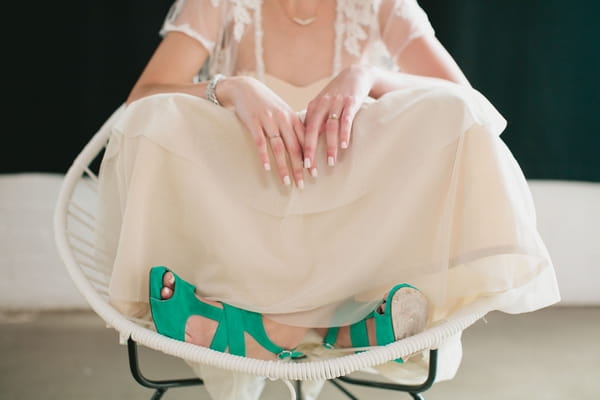 Bride sitting with legs crossed