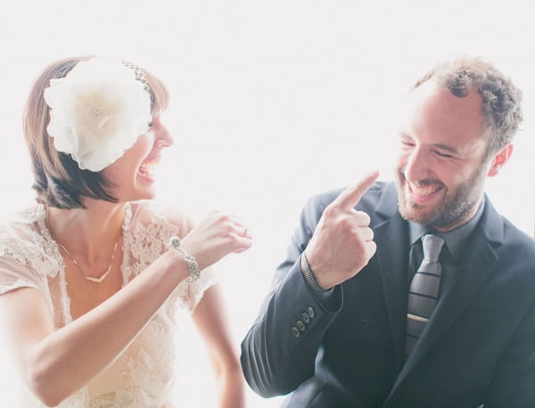 Bride and groom laughing together