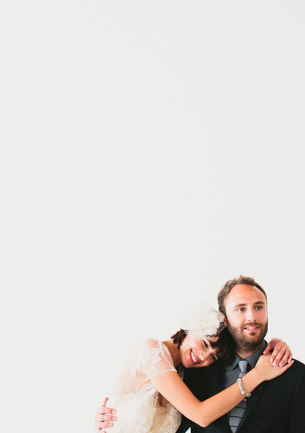 Bride resting head on groom's shoulder