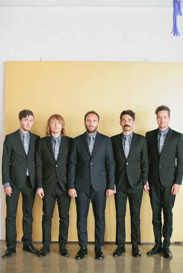 Groomsmen standing in a line