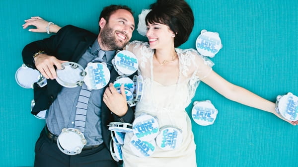 Bride and groom surrounded by tambourines