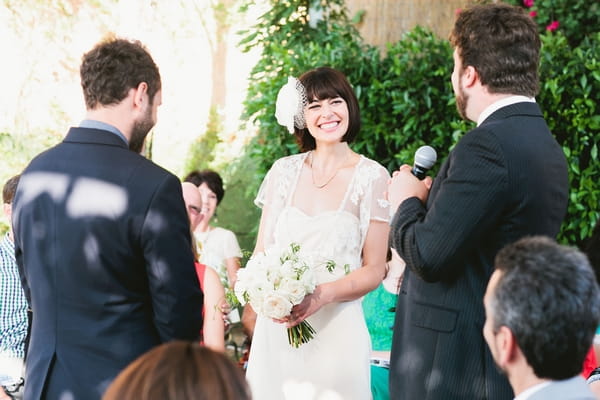 Bride smiling during wedding ceremony