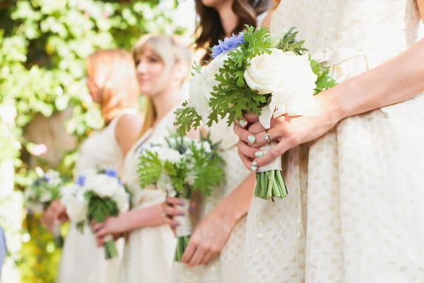 Bridesmaids holding bouquets