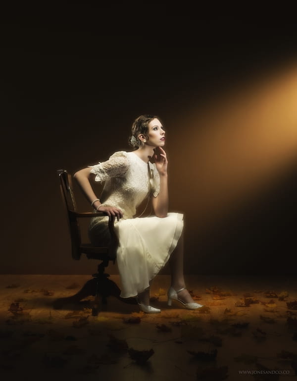 1920's bride sitting on chair