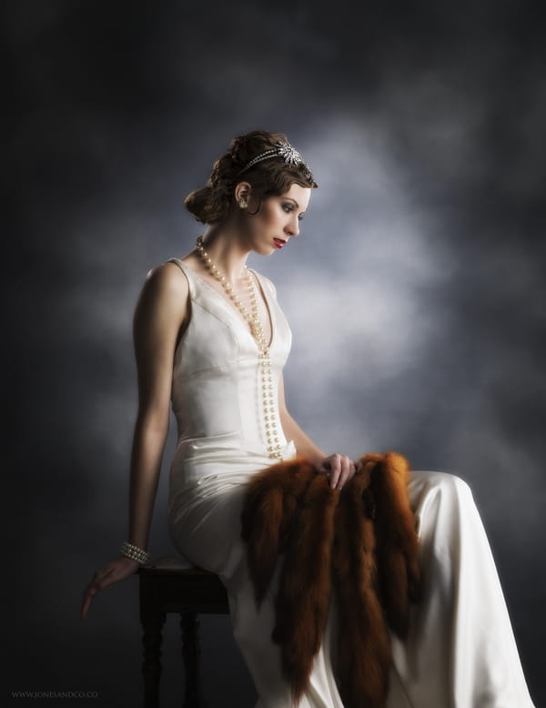 1920's bride posing on chair