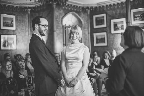 Black and white picture of bride and groom in wedding ceremony