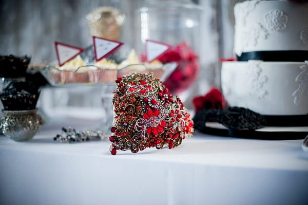 Red heart brooch bouquet on table