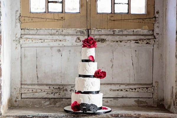 Tiered red and white wedding cake