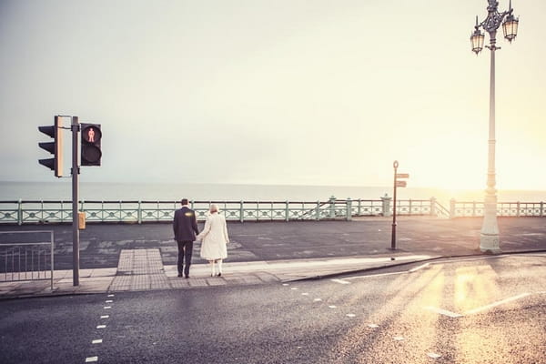 Bride and groom crossing road