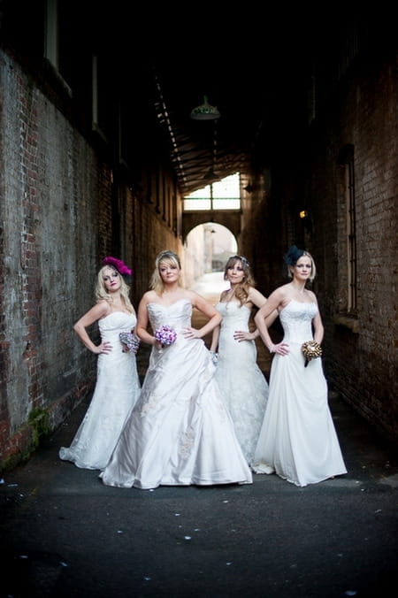 Brides standing under arch