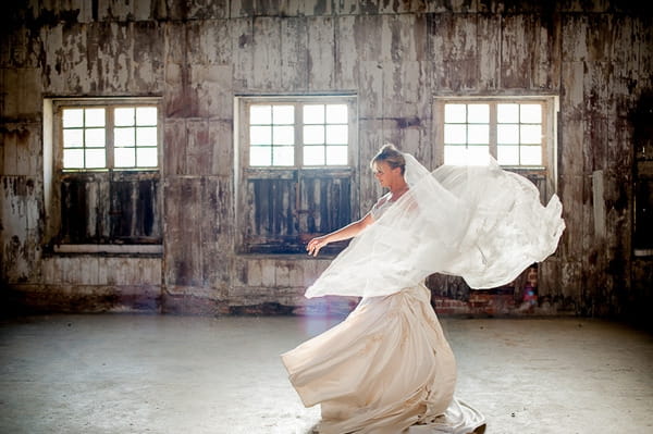 Bride twirling with veil flowing