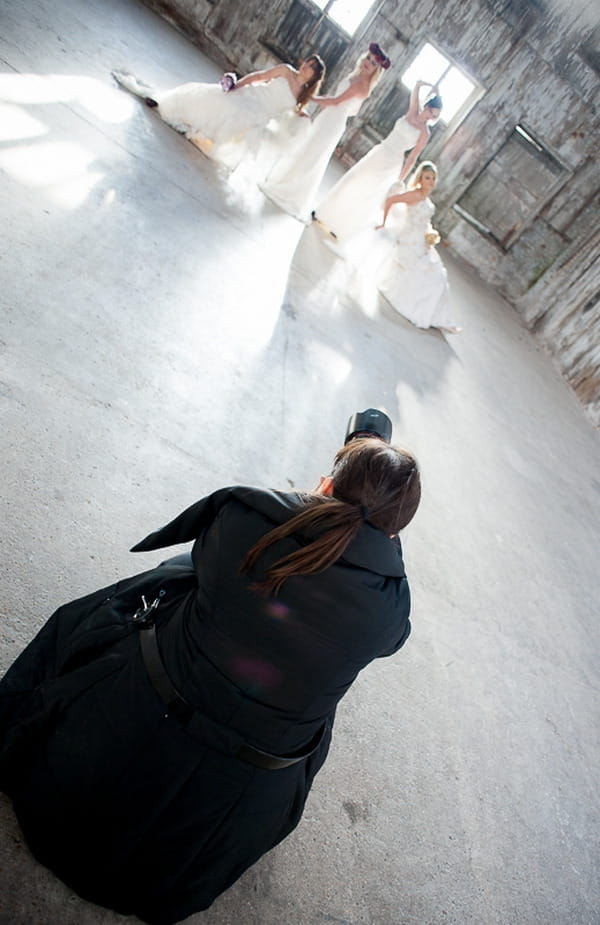 Photographer taking picture of brides
