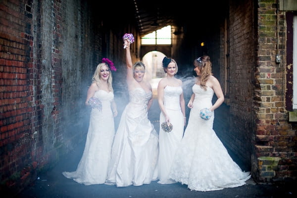 Brides posing by walkway