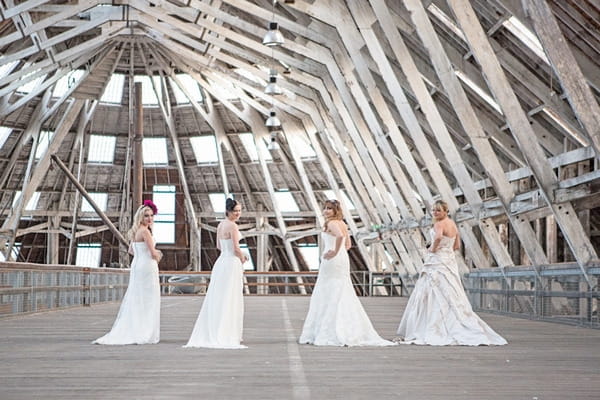 Four brides with back to camera