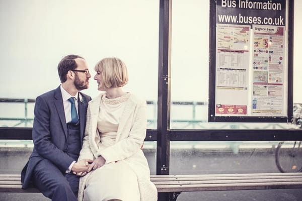 Bride and groom in bus shelter