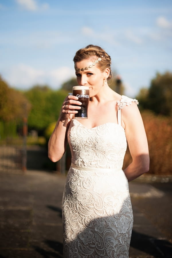 Bride drinking pint of Guinness