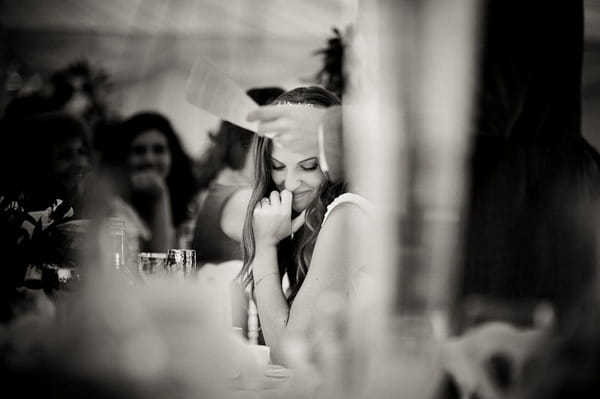 Bride smiling during wedding speech - Picture by Kristian Leven Photography