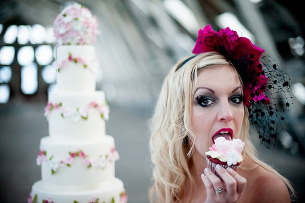 Bride eating cupcake