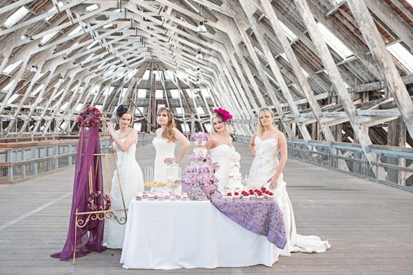 Four brides with cake table