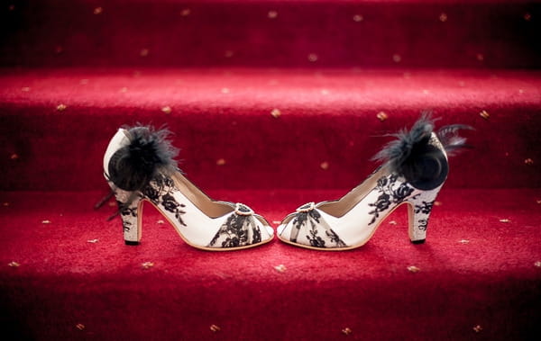 White and black wedding shoes on stairs