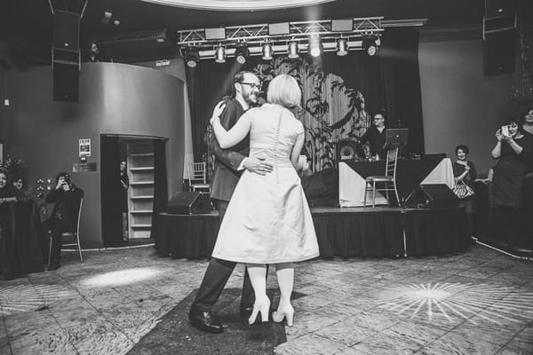 Black and white picture of bride and groom first dance