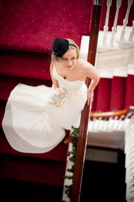 Bride standing on stairs looking up