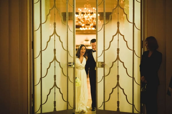 Bride and groom in between doors - Picture by Kristian Leven Photography