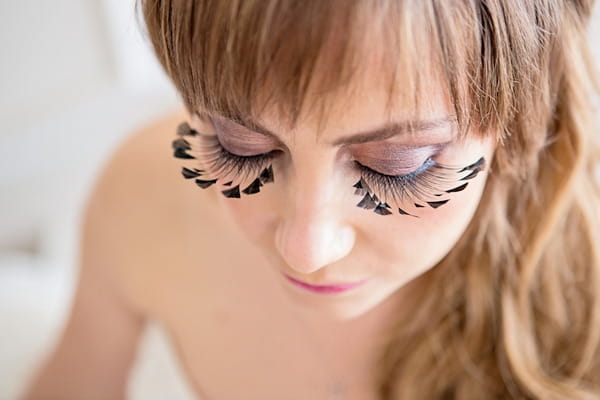 Long false eyelashes on bride