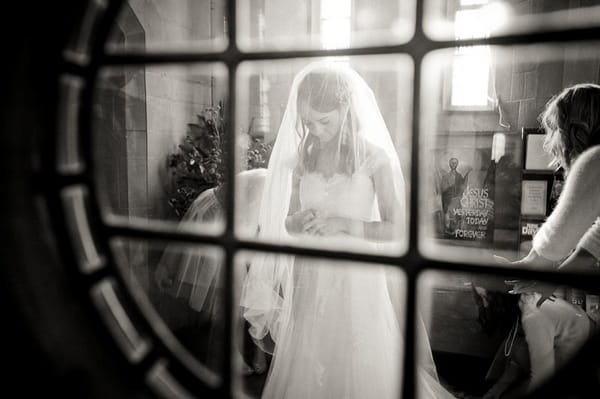 Bride through window - Picture by Kristian Leven Photography