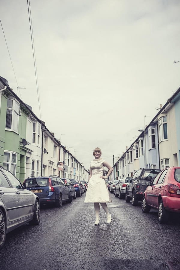 Bride posing in middle of road