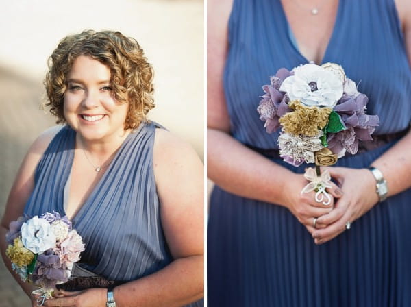 Bridesmaid in blue dress holding bouquet