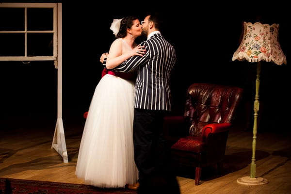 Bride and groom kiss