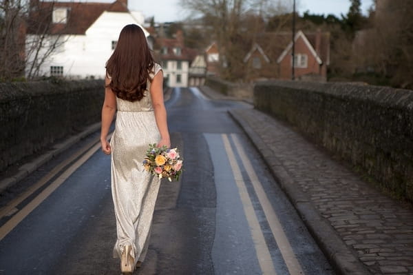 Bride walking down road