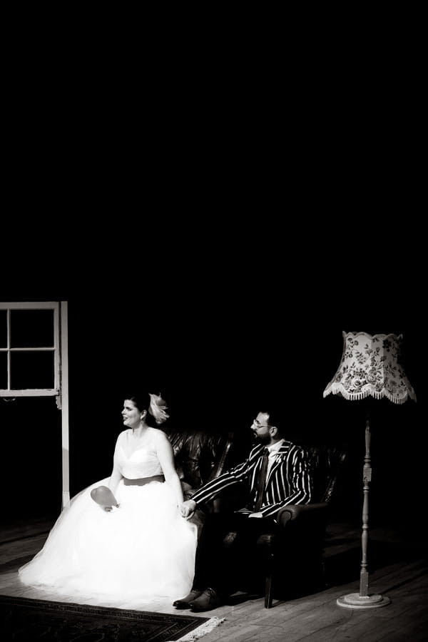 Bride and groom sitting in chairs in the De La Warr Pavilion