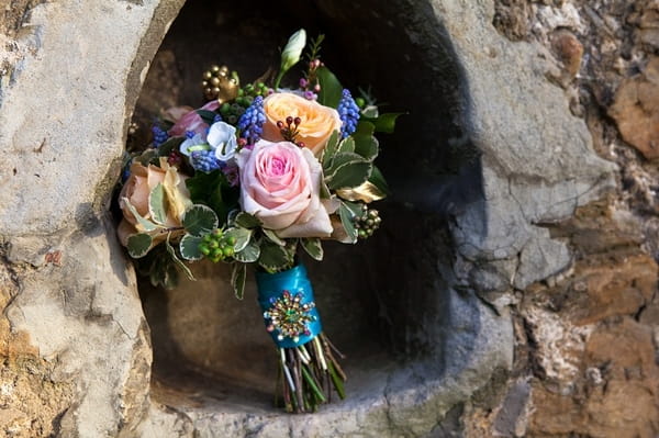 Bouquet in hole in wall